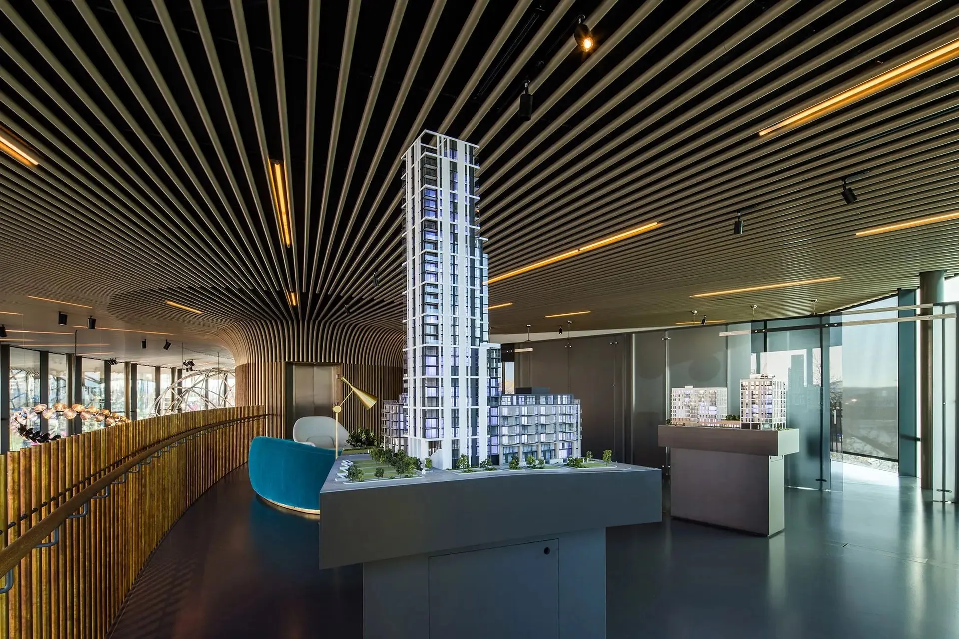 An architectural model of a tower inside the timber-slatted marketing suite