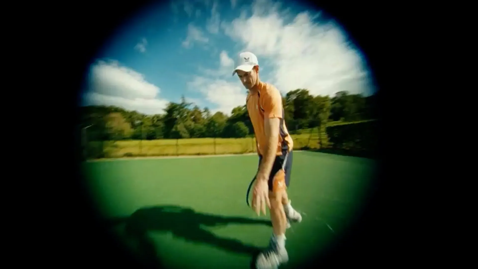 Andy Murray on court, seen through a fisheye lens
