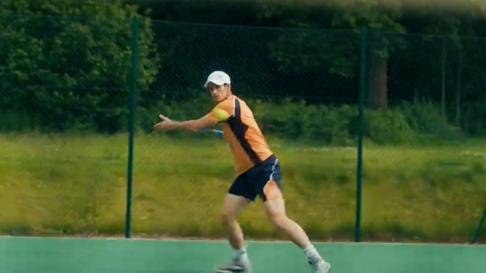 Andy Murray mid-swing on court