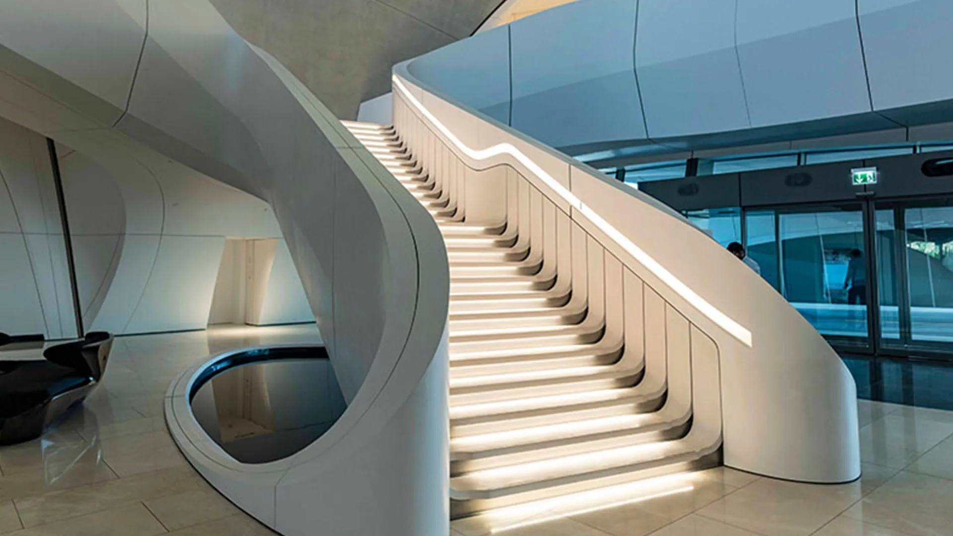 The sweeping white staircase inside the Bee'ah headquarters