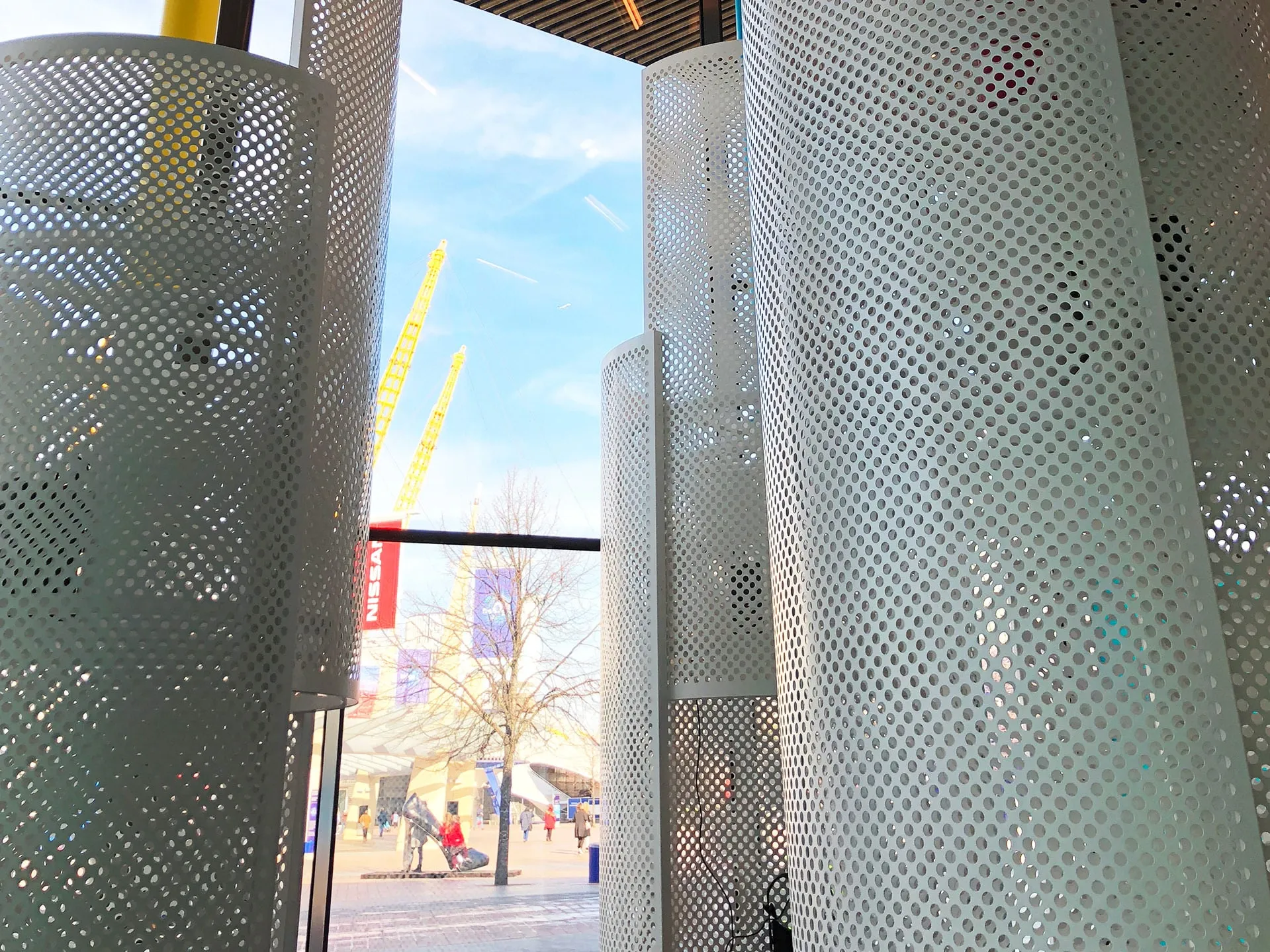 Perforated white columns framing a view out to the peninsula